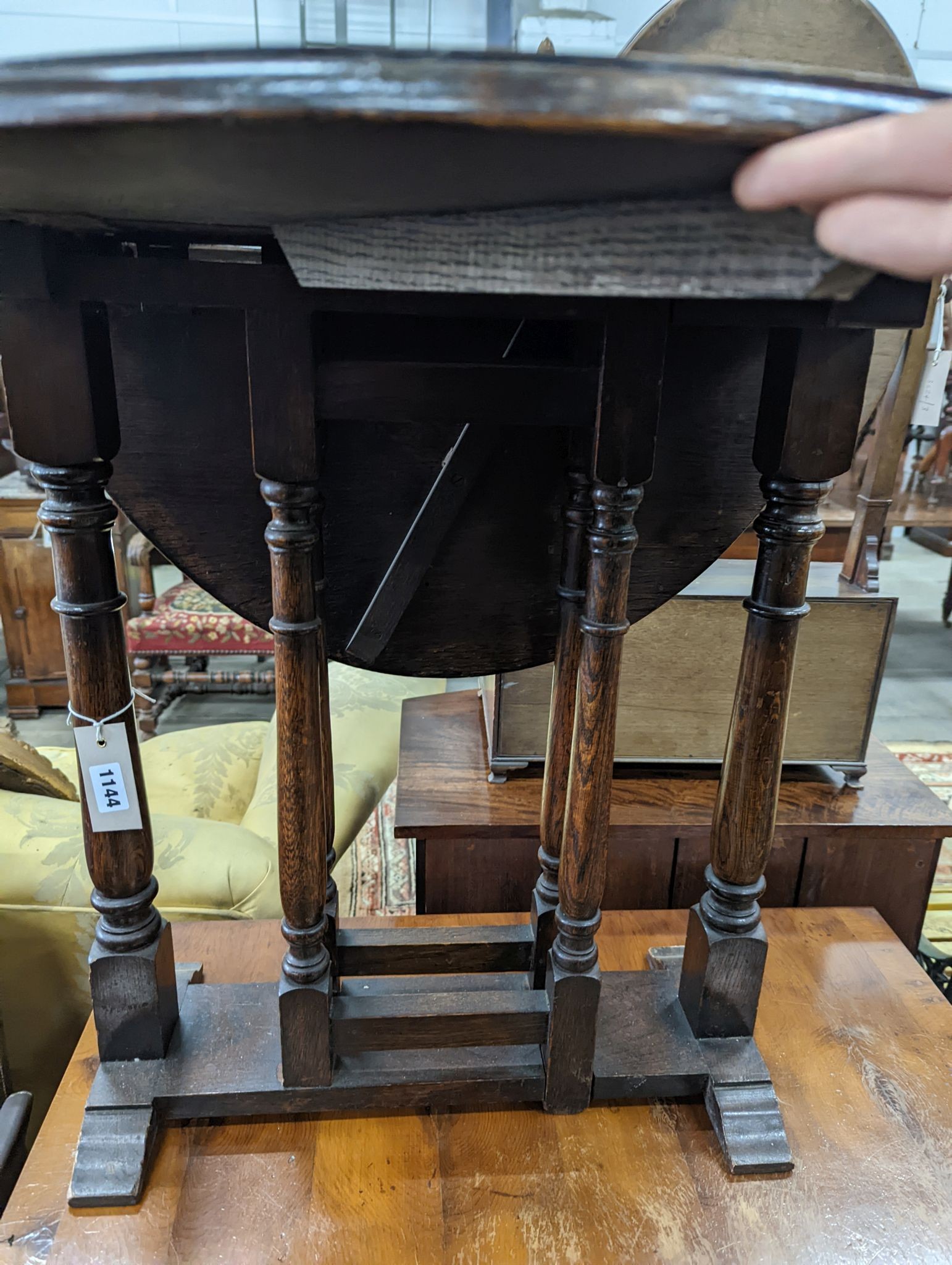 An 18th century style oak drop flap occasional table, width 60cm, height 62cm